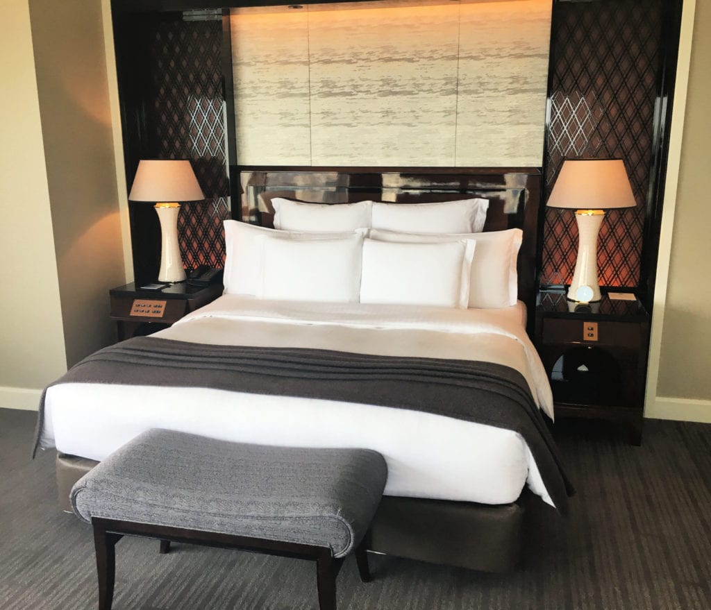King bed in the separate bedroom to the suite
