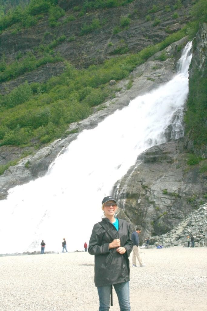 While in Alaska, I always bring a raincoat with a hood and I often wear a hat. There are gloves in my pockets because my hands are always cold