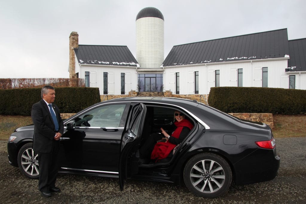 Private sedan that pick you up in front of the hotel.