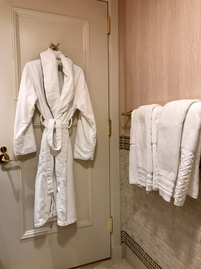 Plush robes and linens available in The Grand Luxe, Larger Guest room