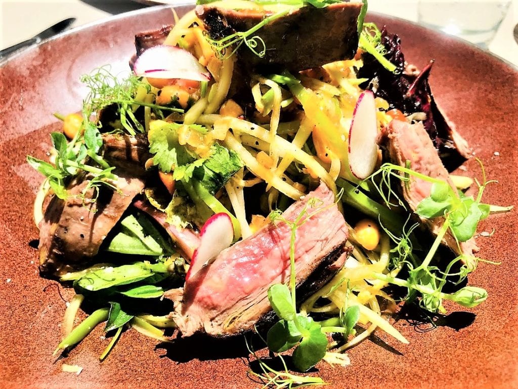 Marinated Skirt Steak | peanuts, green papaya, Thai basil chili dressing 