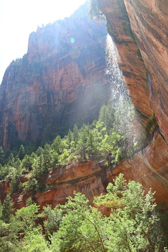 Best Places To Visit From California to Utah: Emerald Pools hike. The cool mist of the waterfall felt so good on a hot day!